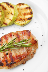 Grilled steak and grilled vegetables isolated on white