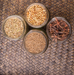 Spices and herb varieties over a wicker background 
