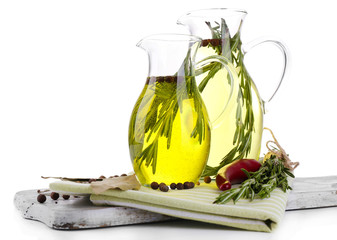 Essential Oil with rosemary in glass jug,
