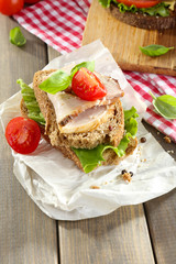 Delicious sandwiches with meet on table close-up