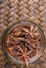 Star anise spice over a wicker background 