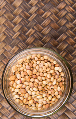 Coriander seed over a wicker background 