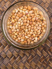Coriander seed over a wicker background 