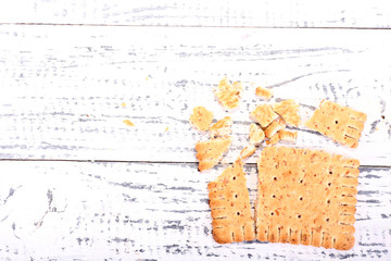 Crushed cookie on wooden background