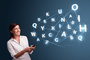 Young woman typing on smartphone with high tech 3d letters commi