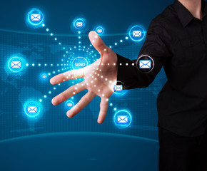 Businessman pressing virtual messaging type of icons