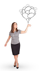 Happy woman holding balloons drawing