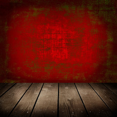 Old room with red wall and wooden floor