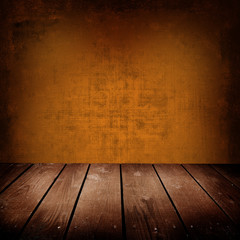 old room with brown wall and wooden floor