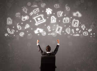 Business man looking at modern icons and symbols