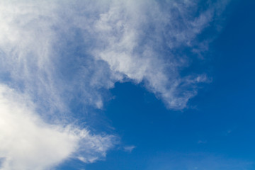 Fototapeta na wymiar Background with white clouds on a beautiful blue sky