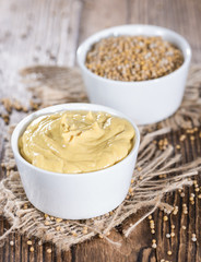 Mustard (on wooden background)