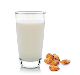 glass of milk and almond isolated on white background