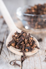Cloves on a wooden spoon