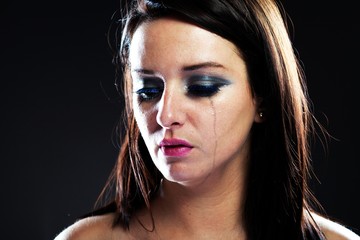 Hurt woman crying, smeared makeup