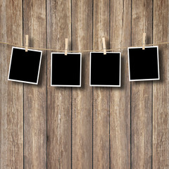 Polaroids in front of woodbackground
