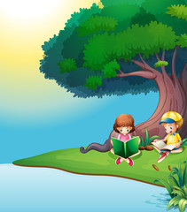 Obraz na płótnie Canvas A boy and a girl reading under the tree