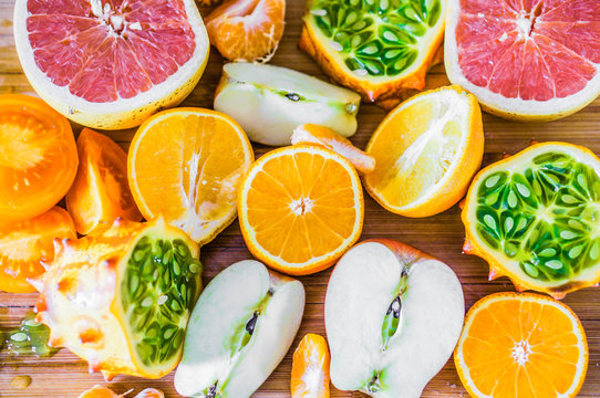 Colorful citrus fruits on rustic background