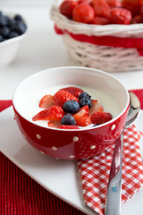 Fresh strawberries with yoghurt for breakfast