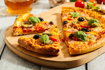 Pizza with bacon, olives and jalapeno pepper