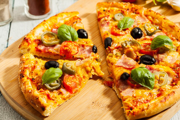 Pizza with bacon, olives and jalapeno pepper