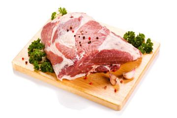 Fresh raw pork on cutting board on white background