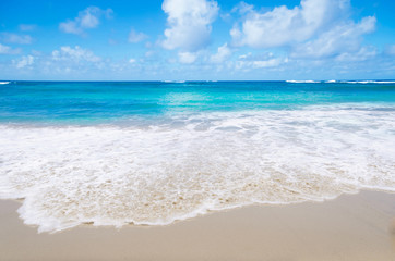 Wave on the sandy beach - 64801078