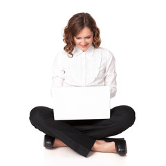 Portrait of a pretty young woman sitting in front of her laptop