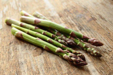 Fresh roots of asparagus vegetable on the wooden table