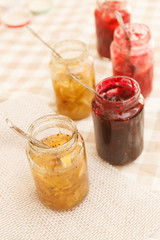 different jars full of fruity jam