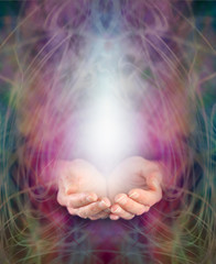 Healer's cupped hands and energy manifestation