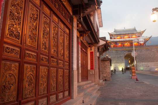 Old house and city gate in ancient city of Dali .