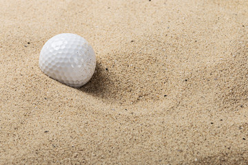 golf ball on the sand