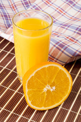 Glass of juice with a slice of orange
