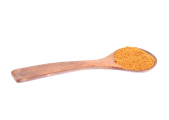 Orange Spice in Wooden Spoon Isolated on White Background