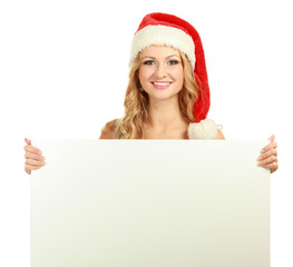 Beautiful christmas woman in santa hat holding empty board