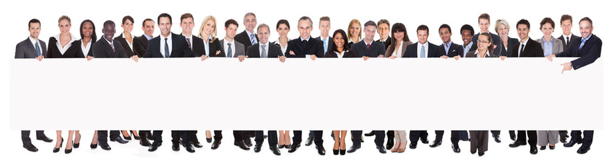 Multiethnic Businesspeople Holding Blank Billboard