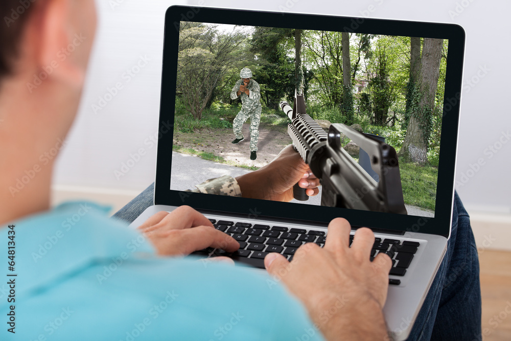 Poster Man Playing Action Game On Laptop