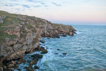 sunset over blue sea waves