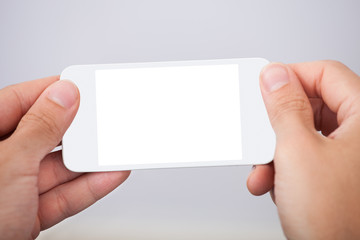 Hand Holding Smartphone With Blank Screen