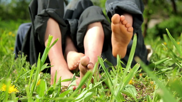 Feet and legs child, Baby's feet in the grass