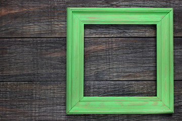 Wooden frame on wooden background