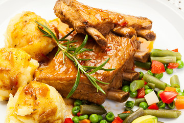 Pork spareribs served with mashed potatoes