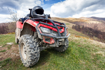 ATV on mountains landscape on a sunny day