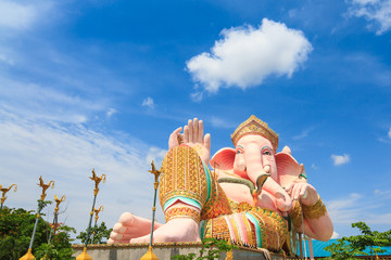 Ganesha statue in public temple against blue sky