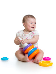 adorable baby playing with color toy