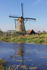 White windmill and house