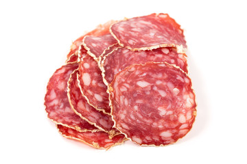 Slices of salami sausage on a white background