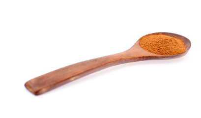 Orange Spice in Wooden Spoon Isolated on White Background