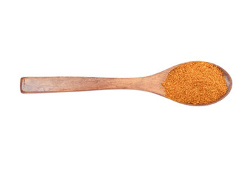 Orange Spice in Wooden Spoon Isolated on White Background